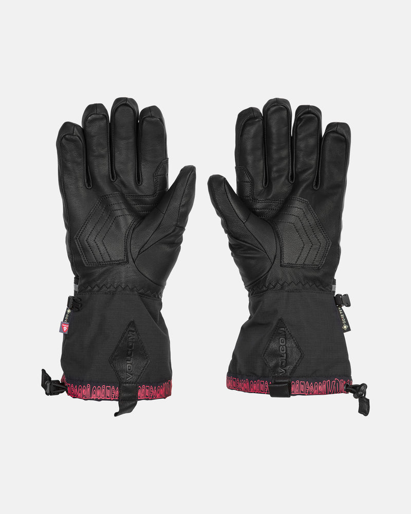 A pair of Volcom Men’s 91 Gore-Tex Gloves in black, featuring Primaloft insulation, textured palms and fingers for enhanced grip, adjustable wrist straps, and red trim along the cuffs, displayed on a white background.