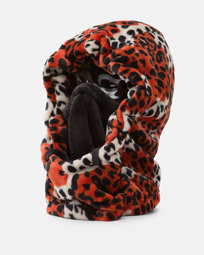 A mannequin head displays the Women’s Dang Hood by Volcom—a plush, red, black, and white leopard-print fleece hooded balaclava with a built-in neck warmer and black face covering—set against a plain white background, ideal for cold weather.