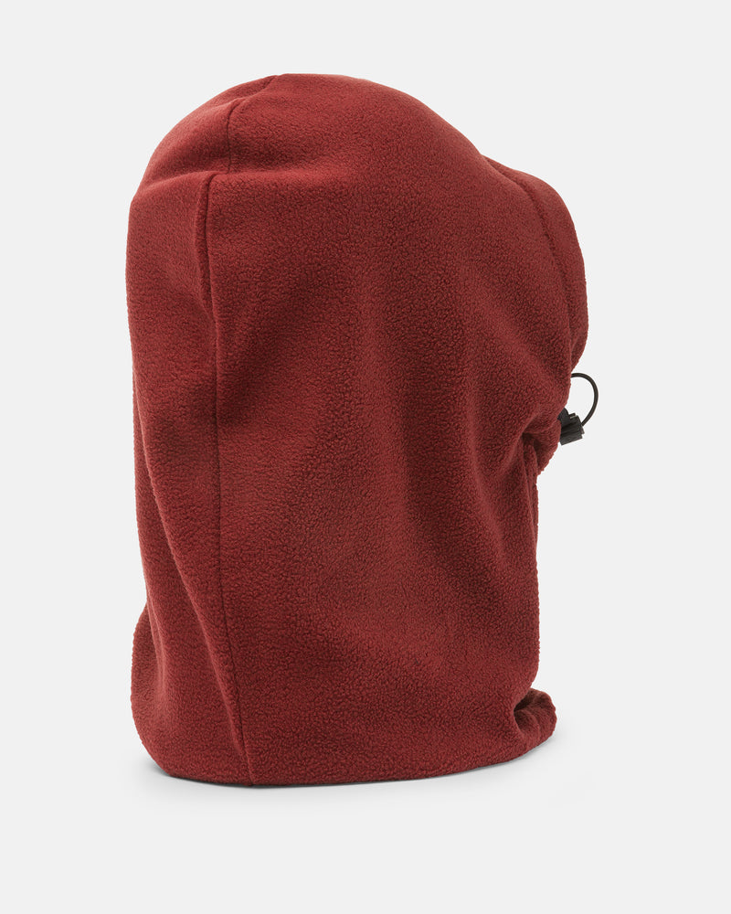 The Women’s V.Scout Hood by Volcom, featured in maroon fleece with a side drawstring and adjustable toggle, is displayed on a white background and can be worn as either a cozy fleece neck warmer or pulled up as a hood for versatile comfort.
