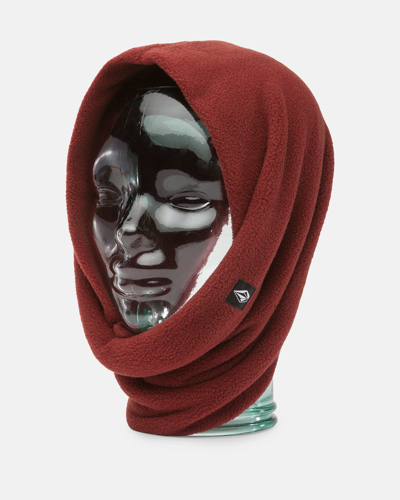 A glass mannequin head displays the Volcom Women’s V.Scout Neckband in deep red, featuring a cozy hooded design crafted from soft polyester fleece for extra warmth, with a small black Volcom logo tag on the side, set against a plain white background.