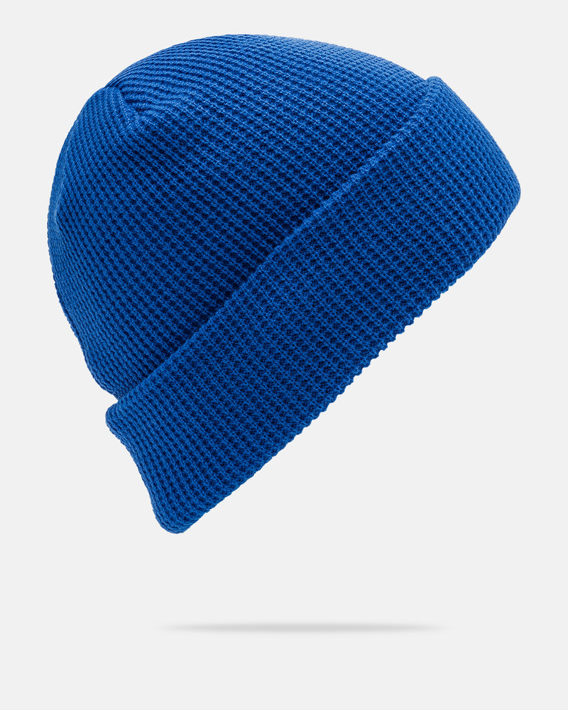 The Women’s Power Beanie by Volcom in royal blue features a knit slouch design with a folded brim, displayed on a plain white background and shown from a side angle.