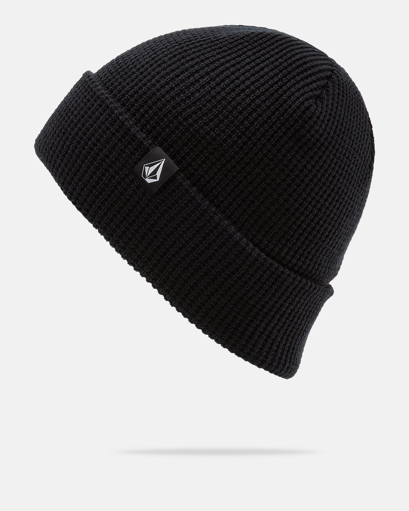 The Women’s Power Beanie by Volcom is a black knit beanie with a folded brim and a small black tag showcasing a white geometric logo, displayed against a plain white background. This Volcom beanie provides both style and comfort for everyday wear.