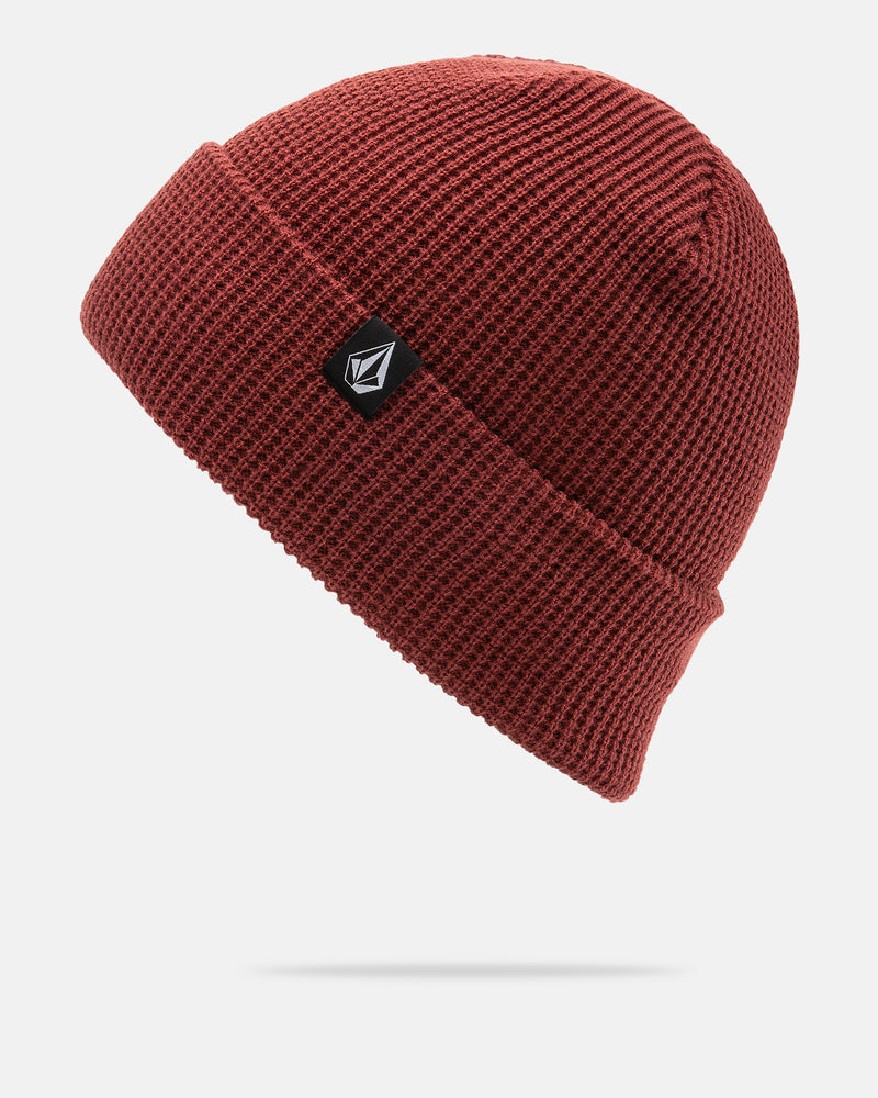 The Volcom Women’s Power Beanie is a red knit acrylic beanie with a folded brim, finished with a small black patch showcasing a white logo. Displayed on a white background, it’s perfect as a stylish women’s beanie or as an easygoing slouch beanie option.