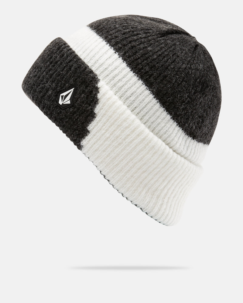 The Women’s 2Tone Beanie by Volcom is crafted from recycled polyester in a slouch fit, featuring a black top half and white bottom half accented by a white stripe and a small geometric logo on the brim. The beanie is displayed at an angle against a plain white background.