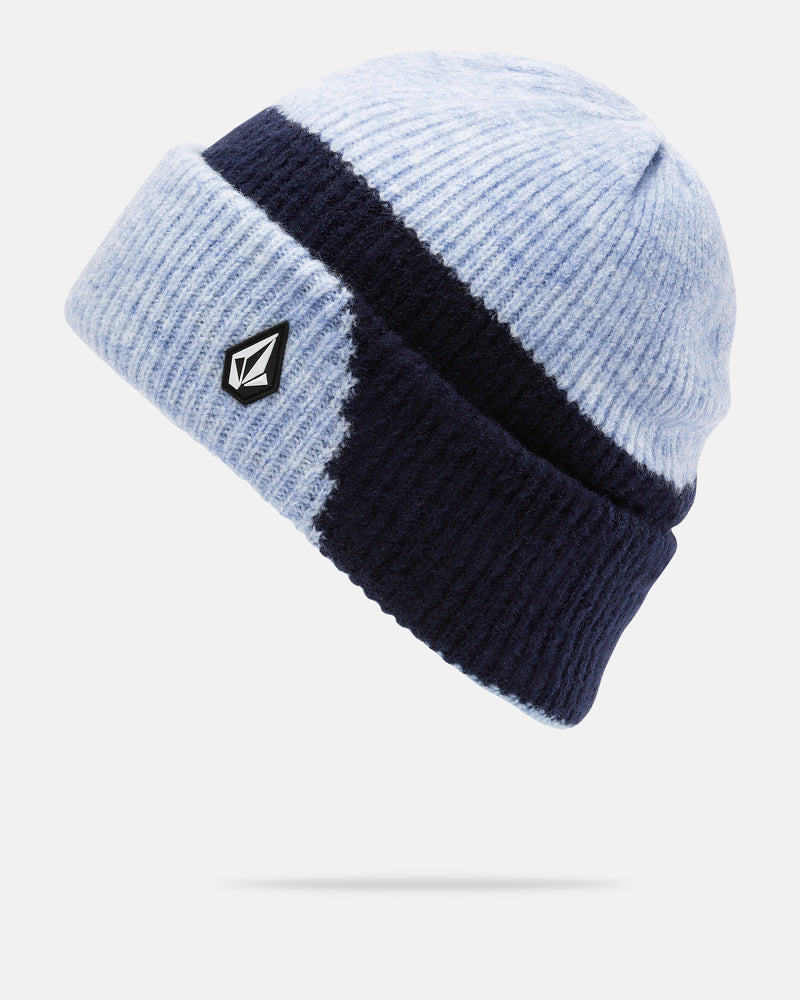 The Volcom Women’s 2Tone Beanie showcases light blue and dark navy color blocking in a ribbed knit design, complete with a folded brim and a small black and white geometric logo patch on the front. Made from recycled polyester, this beanie delivers a comfortable slouch fit for effortless style.