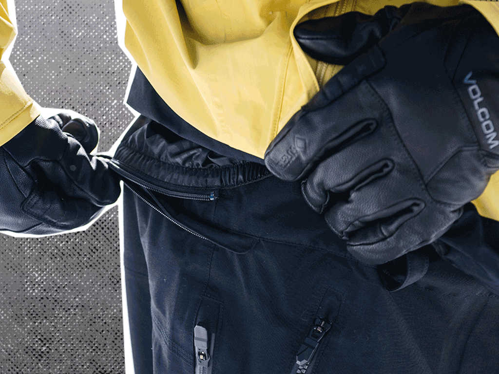 GIF of someone utilizing ZipTech to zip their jacket and pants together with "Zip your jacket to your pants!" text overlay