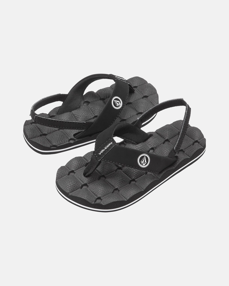 The Volcom Kids' Recliner 2 Little Youth sandals feature comfort foam footbeds, textured soles, and Volcom logos on each strap, shown in black on a plain white background.