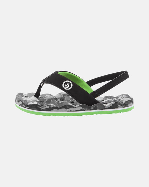 The Volcom Kids' Recliner 2 Little Youth sandal features a black strap, green lining, black-and-gray camo sole, comfort foam footbed, water-friendly design, circular logo on the strap, bright green sole edge, and supportive back strap.