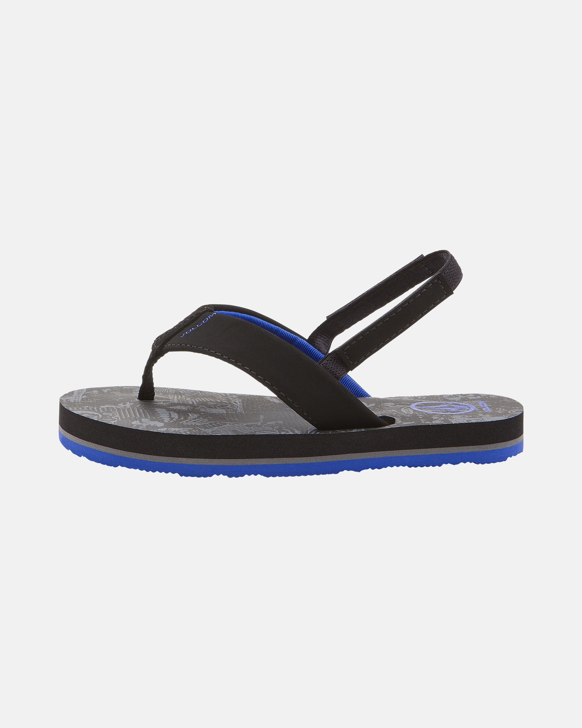 The Volcom Kids' Victor 2 Little Youth sandal, in black and blue with a back strap, is water friendly, features Recliner Comfort Foam, a patterned sole, and a blue bottom for all-day support; shown in profile on white.