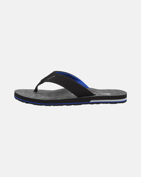 A single Volcom Men's Victor Sandal with a black and blue strap and textured dark gray Recliner Comfort Foam footbed, shown in side view on a plain white background.