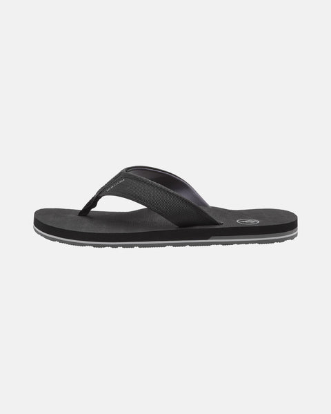 The Volcom Men's Victor Sandals are shown from the side against a white background, featuring a textured rubber sole and wide fabric thong strap—ideal water-friendly sandals for all-day comfort.