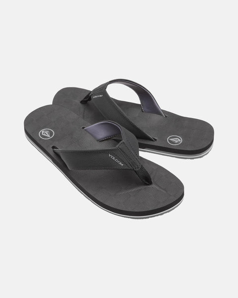 A pair of black Men's Victor Sandals by Volcom with textured soles, sturdy fabric straps, and Recliner Comfort Foam for support. These water-friendly sandals are shown on a plain white background.