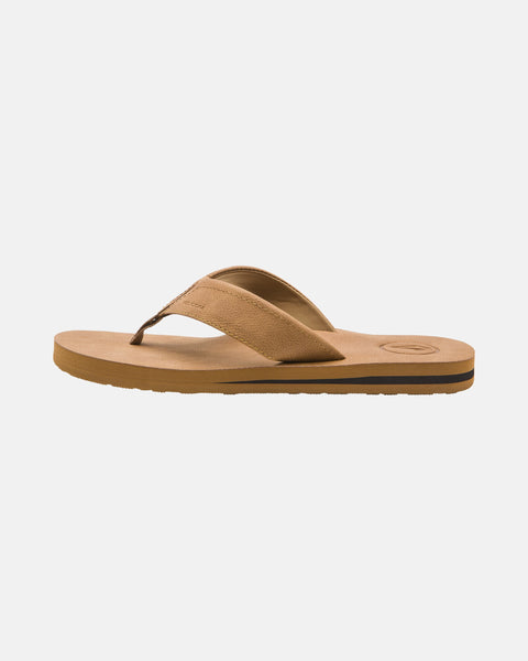 Tan Men's Victor LX Sandals by Volcom, featuring a wide fabric thong strap and cushioned Recliner Comfort Foam sole, shown in side view on a plain white background.