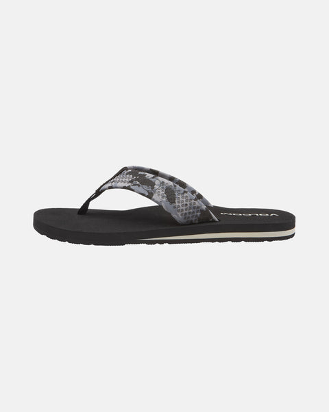 The Volcom Men's Daycation 2 is a black sandal featuring a snake-print strap, textured sole, and supportive EVA footbed, shown side view on a plain white background.
