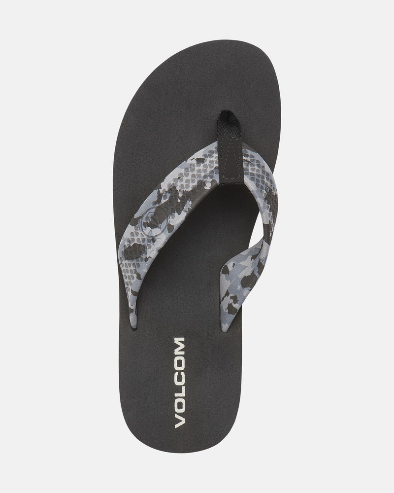 A single black Volcom Men's Daycation 2 sandal with a gray and black patterned strap and white VOLCOM branding on the EVA footbed, plus a molded rubber outsole, displayed on a plain white background.