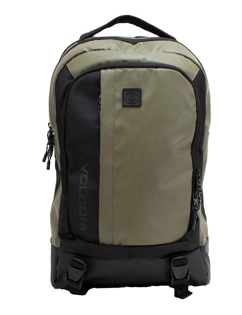 A Men's Venture Backpack by Volcom in green and black, featuring dual zippers, two front buckle straps, a padded laptop sleeve, and a top handle is displayed against a white background. With a 22L capacity, this backpack is ideal for both daily use and outdoor adventures.