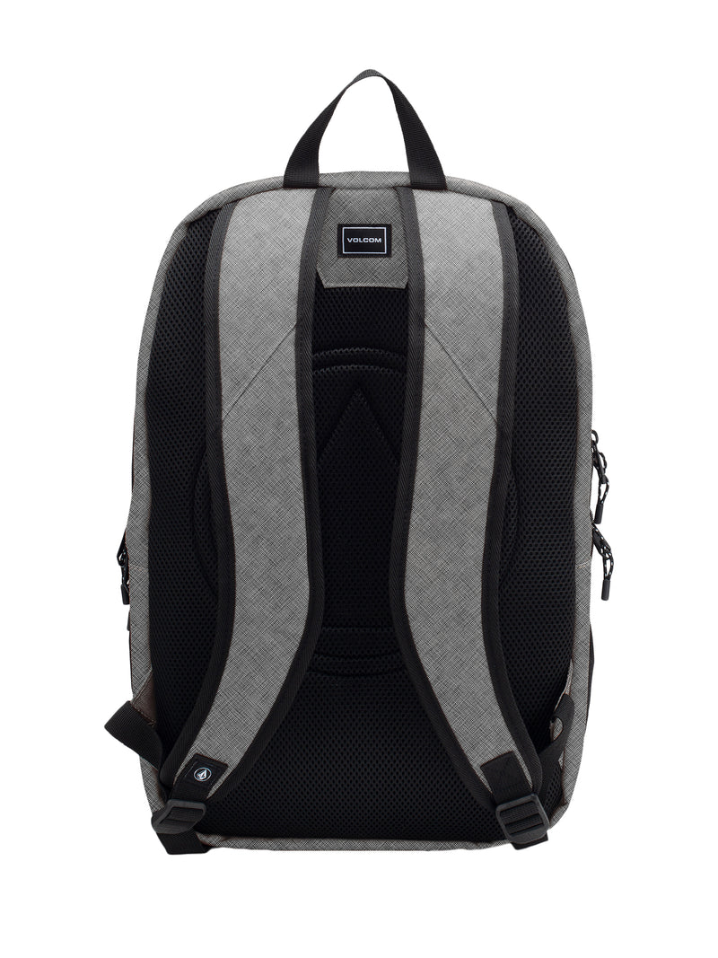 The Men's Roamer 3 Backpack by Volcom is displayed in gray from the back, showcasing ergonomic mesh straps with black padding, a top handle, and a small rectangular Volcom logo near the top center. For added convenience and protection, this backpack also features a padded laptop zone.
