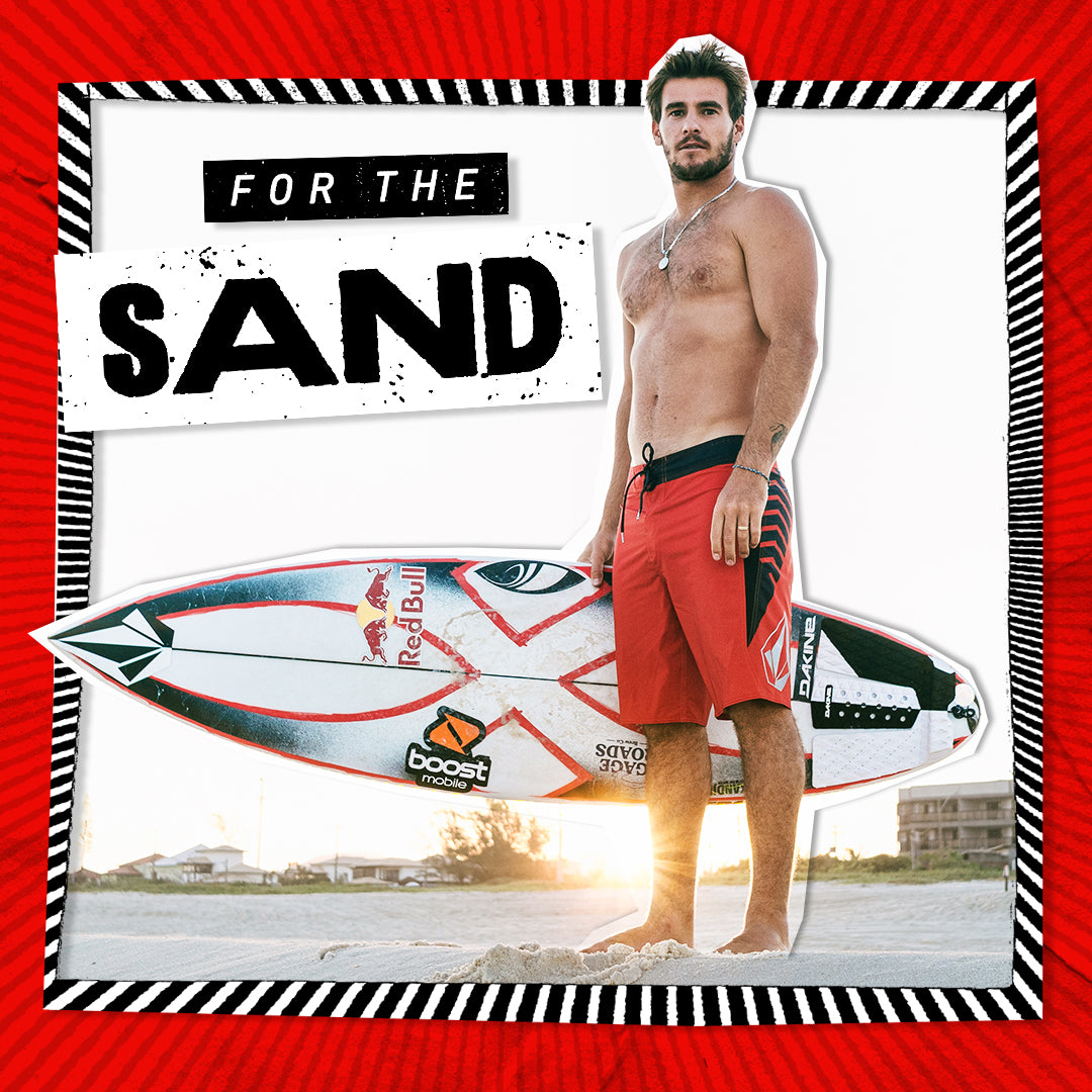 Man holding a surfboard with promotional text 'For the Sand' on a red border.