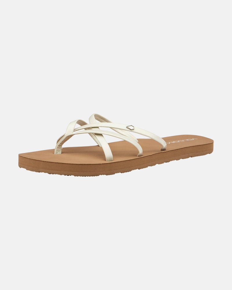 The Volcom Women's New School II sandal features thin white synthetic leather straps, a flat brown sole, and Recliner Comfort Foam, displayed on a white background.