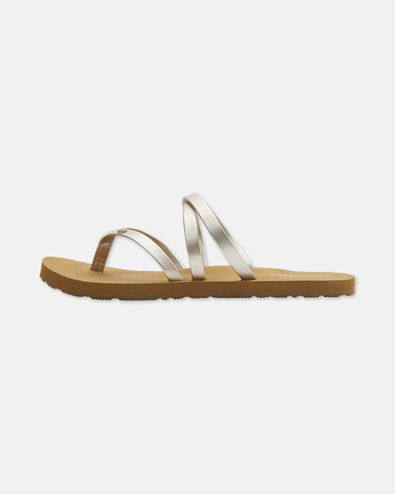 The Easy Breezy II is a strappy sandal with metallic silver straps and a tan flat sole offering gentle arch support, displayed in a side view against a white background.