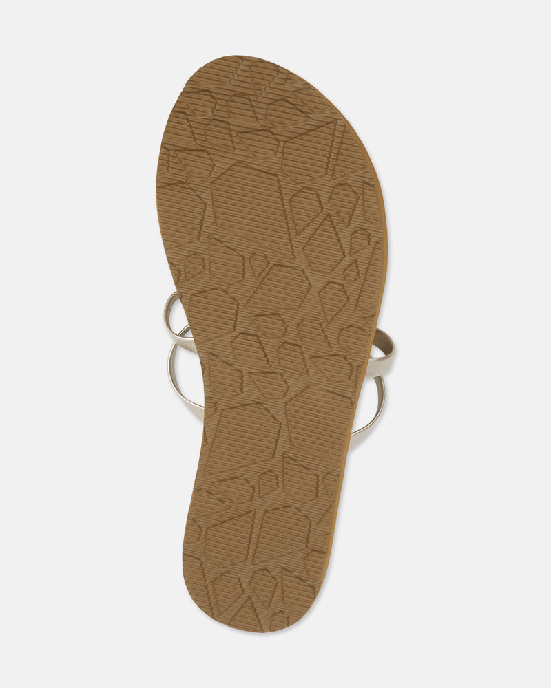 The Easy Breezy II is a brown sandal with thin metallic straps, seen from the bottom. It features a textured sole with geometric patterns and an EVA footbed for added comfort.