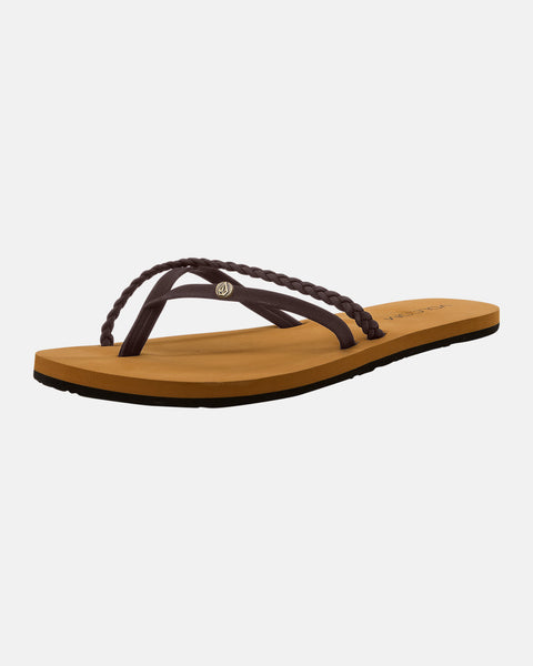The Volcom Women's Thrills II is a flat sandal with a tan sole and dark brown braided synthetic leather straps, molded arch support, shown on a plain white background.