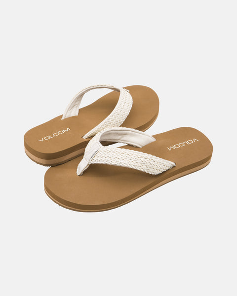 A pair of Volcom Women's Oasis Sandals in brown with woven white straps and "VOLCOM" printed on the footbeds, shown on a white background.
