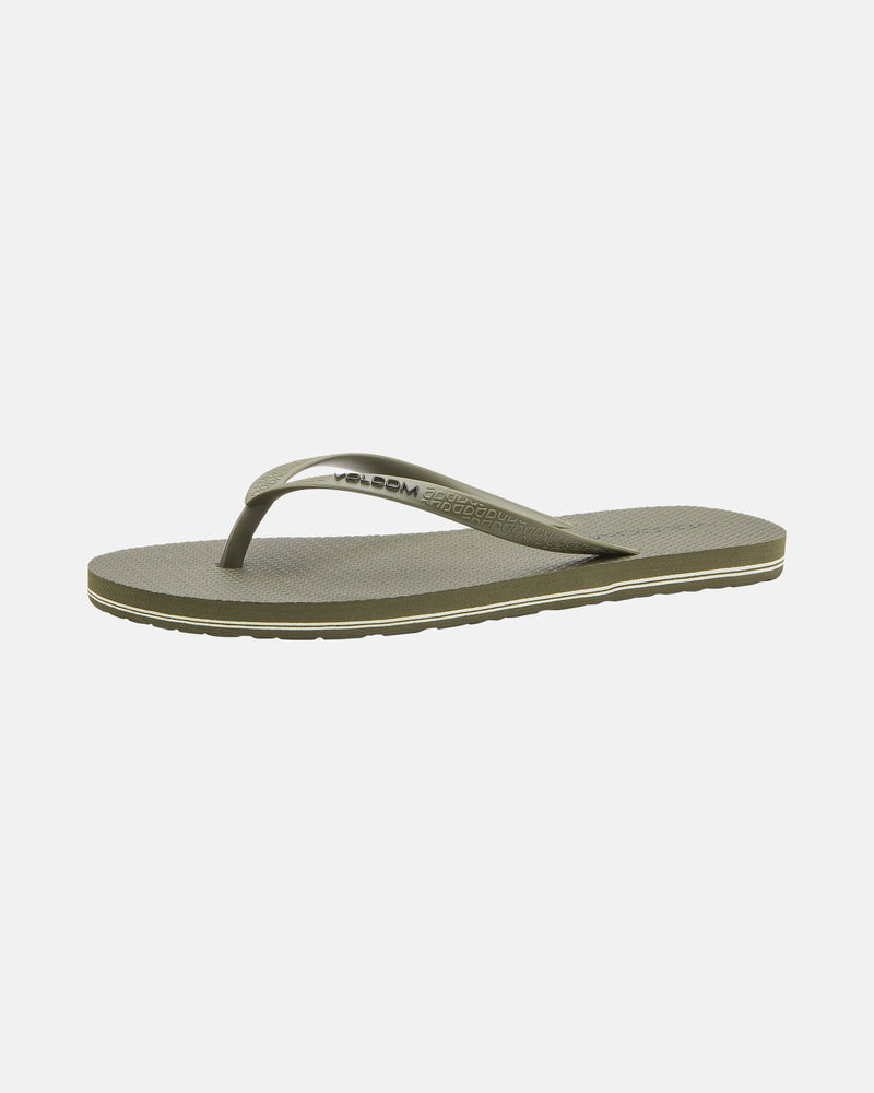 The Volcomotion Womens sandal by Volcom features an olive green color, textured sole, and thin matching strap with the Volcom logo on the side. Displayed against a white background.