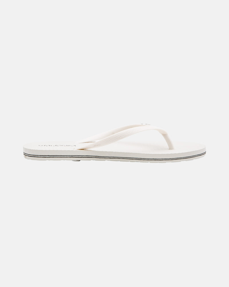 The Volcom Volcomotion Womens sandal features a flat sole and thin straps in white, shown on a plain white background.