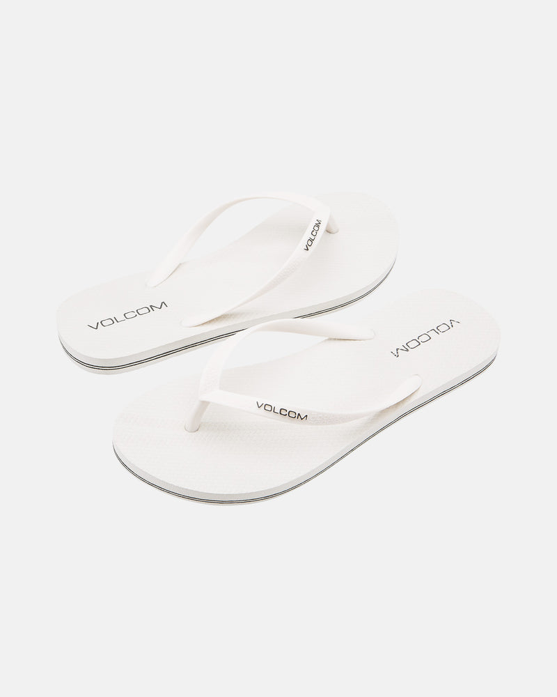 A pair of Volcom Volcomotion Womens white flip-flops with thin straps, featuring the black Volcom logo on the footbeds and straps, shown against a plain white background.