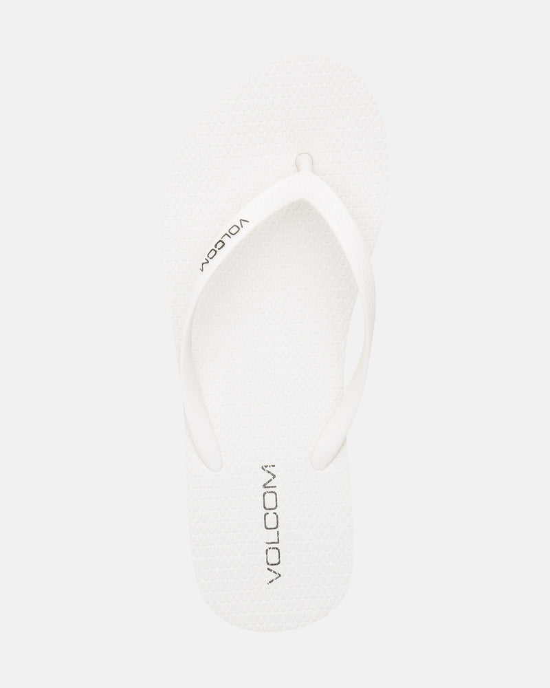 A single Volcomotion Womens white flip-flop sandal by Volcom, featuring the brand name in black on the footbed, displayed against a plain white background.