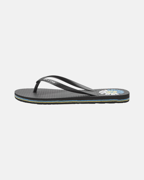 The Women's Volcomotion Wos Hawaii sandal by Volcom is a black flip-flop with a simple strap and colorful floral design near the heel, displayed on a plain white background.