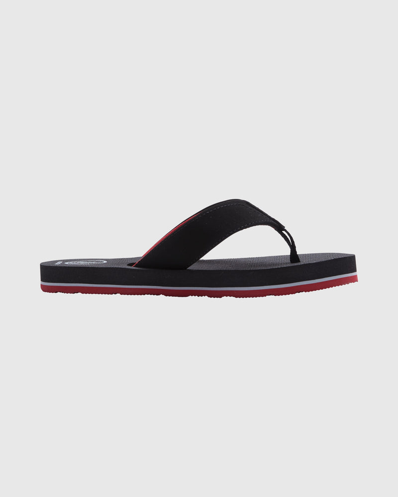 A side-view of the Volcom Kids' Victor Big Youth sandal in black, featuring a thick sole and a red accent along the bottom edge on a light gray background. The water-friendly footbed offers comfort for pool or beach wear.