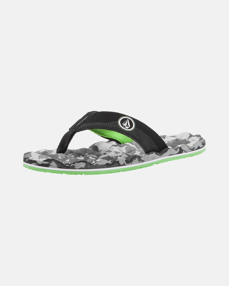 The Volcom Kids' Recliner 2 Big Youth sandal features a black strap with a white logo, a green, grey, and black camo-patterned sole, comfy foam footbed, and light green underside for a stylish, water-friendly design.