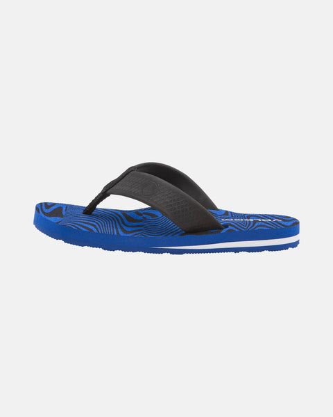 The Volcom Kids' Daycation 2 Big Youth sandal is blue with a textured black strap, a wavy-patterned sole, and Recliner Comfort Foam for arch support, shown from the side on a plain white background.