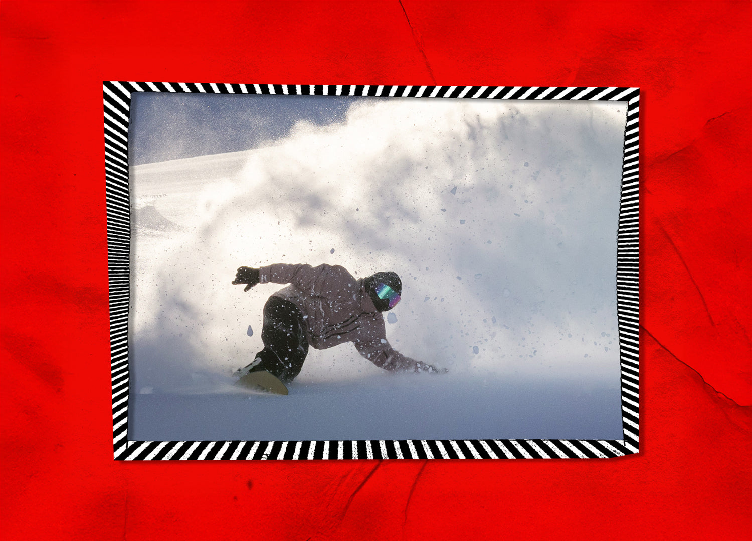 Person snowboarding in the snow with a red border and black and white striped frame.