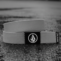 Gray belt with Volcom logo on a textured surface
