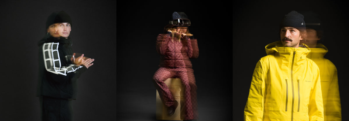 Three fashion models shown against a black studio background, each wearing a different outfit: a black jacket with glowing white geometric lines, a red patterned puffer suit, and a bright yellow hooded jacket with motion blur.