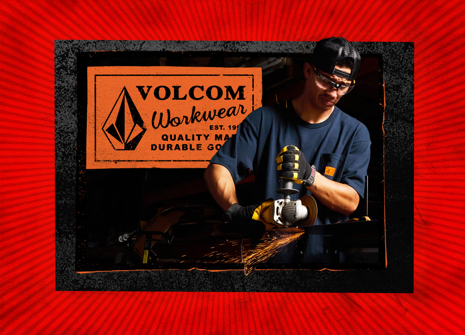 Person using a grinder with Volcom Workwear logo in the background